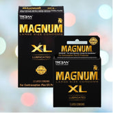 Displayed are boxes of Trojan Magnum XL Extra Large Lubricated Condoms from the Trojan brand, made with premium latex. One box contains 12 condoms, and the other holds 3. The softly blurred background showcases multicolored bokeh lights, adding a vibrant touch to the scene.